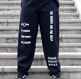 Black Preview Sweatpants by The Heights and The Hills. Features the text "Ladera," "Baldwin," and "View Park-Windsor," in the center of the right pant leg, and the text "The Heights and The Hills" fashioned diagonally in the center of the left pant leg. The lower left pant-leg features the zip codes 90008, 90056, 90043 stacked on top of each other. Only available at TheHeightsAndTheHills.com