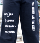 Black Preview Sweatpants by The Heights and The Hills. Features the text "Ladera," "Baldwin," and "View Park-Windsor," in the center of the right pant leg, and the text "The Heights and The Hills" fashioned diagonally in the center of the left pant leg. The lower left pant-leg features the zip codes 90008, 90056, 90043 stacked on top of each other. Only available at TheHeightsAndTheHills.com